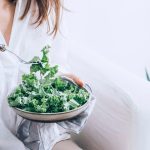 Woman Eating Healthy Kale Salad